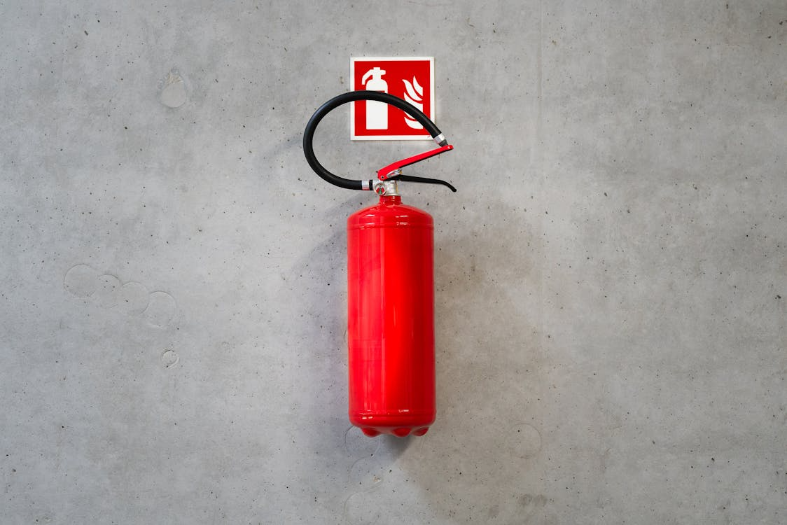 Fire extinguisher mounted to concrete wall
