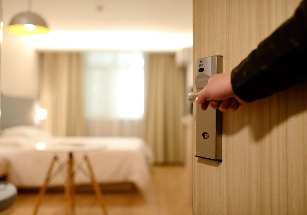 Opening door to hotel room